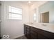 Bathroom with dark brown vanity and double sinks at 1537 Hanover St, Danville, IN 46122