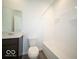 Clean bathroom with a tub and dark brown vanity at 1537 Hanover St, Danville, IN 46122