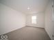 Bright bedroom with window and carpet flooring at 1537 Hanover St, Danville, IN 46122