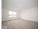 Spacious bedroom with carpet flooring and large window at 1537 Hanover St, Danville, IN 46122