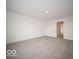 Spacious bedroom with carpet and access to hallway at 1537 Hanover St, Danville, IN 46122