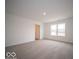 Bright bedroom featuring a window and access to a bathroom at 1537 Hanover St, Danville, IN 46122