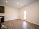 Bright dining area with hardwood floors and access to patio at 1537 Hanover St, Danville, IN 46122