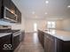 Open concept kitchen with stainless steel appliances and island at 1537 Hanover St, Danville, IN 46122