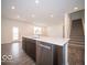 Modern kitchen with island, stainless steel appliances, and hardwood floors at 1537 Hanover St, Danville, IN 46122