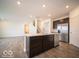 Open concept kitchen with island and stainless steel appliances at 1537 Hanover St, Danville, IN 46122