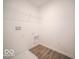 Convenient laundry room with shelving and vinyl flooring at 1537 Hanover St, Danville, IN 46122