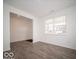 Spacious living room with wood-look floors and large windows at 1537 Hanover St, Danville, IN 46122