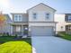 Two-story home with gray siding and a gray garage door at 1543 Hanover St, Danville, IN 46122