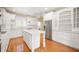 White kitchen features stainless steel appliances and an island at 4176 N 625 W, Bargersville, IN 46106
