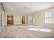 Large living room with carpeting, views of kitchen and staircase at 4176 N 625 W, Bargersville, IN 46106