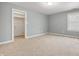 Light grey bedroom with carpet and access to a closet at 4176 N 625 W, Bargersville, IN 46106