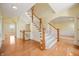Elegant staircase with wooden railing and hardwood floors at 4176 N 625 W, Bargersville, IN 46106