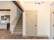 Bright entryway with staircase and view into kitchen area at 3657 Sycamore Bend S Way, Columbus, IN 47203