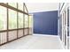 Relaxing screened porch with concrete flooring and a view of the backyard at 3657 Sycamore Bend S Way, Columbus, IN 47203