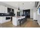 Modern kitchen featuring white cabinets, granite countertops, stainless steel appliances, and a large island at 814 East 21St St, Indianapolis, IN 46202