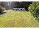 Aerial view of a mobile home on a wooded lot at 7242 N Stafford Ln, Martinsville, IN 46151