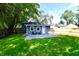 Charming backyard with small shed and green lawn at 2035 N Tibbs Ave, Indianapolis, IN 46222