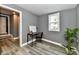 Home office with desk, chair, and leafy plant at 2035 N Tibbs Ave, Indianapolis, IN 46222