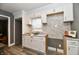Renovated kitchen with white cabinets and marble backsplash at 2035 N Tibbs Ave, Indianapolis, IN 46222