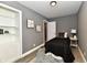 Charming bedroom with twin bed and built-in shelving at 2035 N Tibbs Ave, Indianapolis, IN 46222