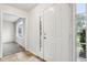 Entryway with tiled floor, white door and view into living room at 3735 Crickwood Dr, Indianapolis, IN 46268