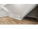 Finished attic space with hardwood floors and sloped ceilings at 847 Lincoln St, Indianapolis, IN 46203