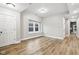 Bright living room with hardwood floors and large window at 847 Lincoln St, Indianapolis, IN 46203