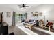 Living room with comfy couch, access to deck, and lots of natural light at 6517 Emerald Hill Ct # Apt 312, Indianapolis, IN 46237