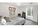 Cozy bedroom with a queen bed, bookshelf, and window at 6517 Emerald Hill Ct # Apt 312, Indianapolis, IN 46237