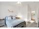 Bedroom with ensuite bath access and dresser at 6517 Emerald Hill Ct # Apt 312, Indianapolis, IN 46237