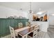 Bright dining room with a farmhouse style table and chairs at 6517 Emerald Hill Ct # Apt 312, Indianapolis, IN 46237
