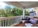 Apartment balcony overlooking a treetop canopy at 6517 Emerald Hill Ct # Apt 312, Indianapolis, IN 46237