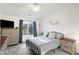 Spacious bedroom with large window and ceiling fan at 6517 Emerald Hill Ct # Apt 312, Indianapolis, IN 46237