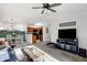 Spacious living area with a flat-screen TV and access to dining area at 6517 Emerald Hill Ct # Apt 312, Indianapolis, IN 46237