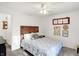 Well-lit bedroom with a double bed and ceiling fan at 6517 Emerald Hill Ct # Apt 312, Indianapolis, IN 46237