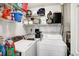 Laundry area with washer, dryer, and storage shelves at 6517 Emerald Hill Ct # Apt 312, Indianapolis, IN 46237
