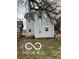 Rear view of house, white siding, small deck at 814 S State Ave, Indianapolis, IN 46203