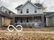 Two story home with gray siding and front porch at 814 S State Ave, Indianapolis, IN 46203