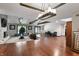Spacious living room features hardwood floors, a fireplace, and ample seating at 8954 Briarclift Rd, Indianapolis, IN 46256