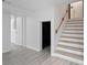 Finished basement with stairs, and light grey flooring at 8954 Briarclift Rd, Indianapolis, IN 46256