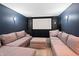 Spacious home theater with sectional sofa and large projection screen at 8954 Briarclift Rd, Indianapolis, IN 46256