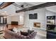 Living room with a stone fireplace and exposed wooden beams at 8954 Briarclift Rd, Indianapolis, IN 46256