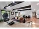 Living room with hardwood floors, exposed beams, and comfortable seating at 8954 Briarclift Rd, Indianapolis, IN 46256