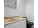 Small bathroom with single vanity and black toilet at 8954 Briarclift Rd, Indianapolis, IN 46256