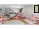 Playroom with toys, hardwood floor, and large window at 8954 Briarclift Rd, Indianapolis, IN 46256