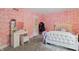bedroom with vanity, pink walls, and carpet at 8954 Briarclift Rd, Indianapolis, IN 46256