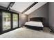 Main bedroom with a king-size bed and access to a private patio at 8954 Briarclift Rd, Indianapolis, IN 46256