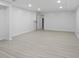 Finished basement with grey flooring and recessed lighting at 8954 Briarclift Rd, Indianapolis, IN 46256