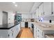 Modern kitchen with white cabinets, stainless steel appliances, and granite countertops at 8954 Briarclift Rd, Indianapolis, IN 46256